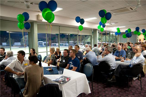 Crowd shot at tables with balloons - launchnight